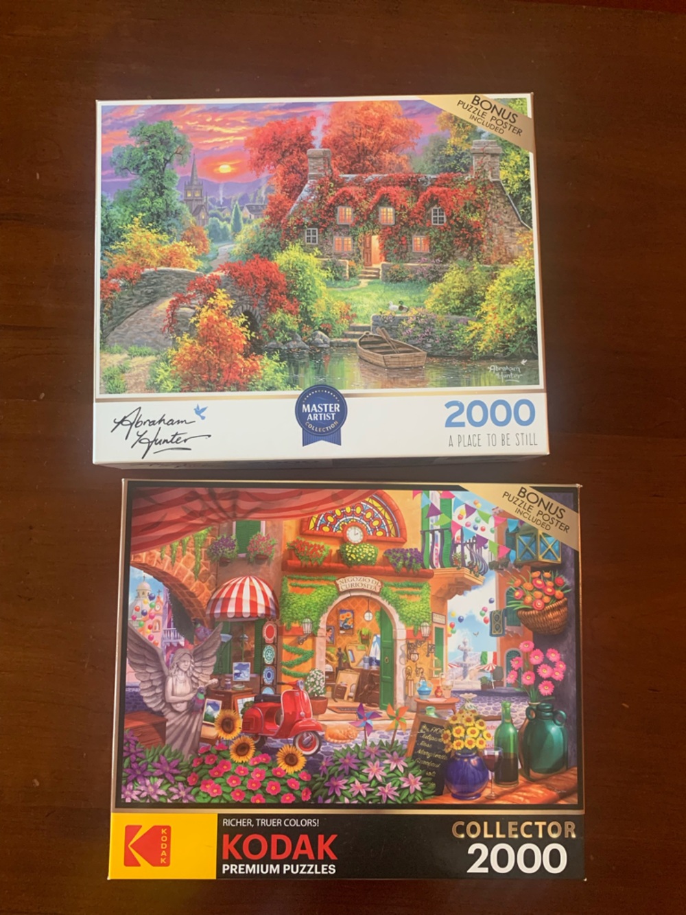 Set of 2 2000 piece jigsaw puzzles.
